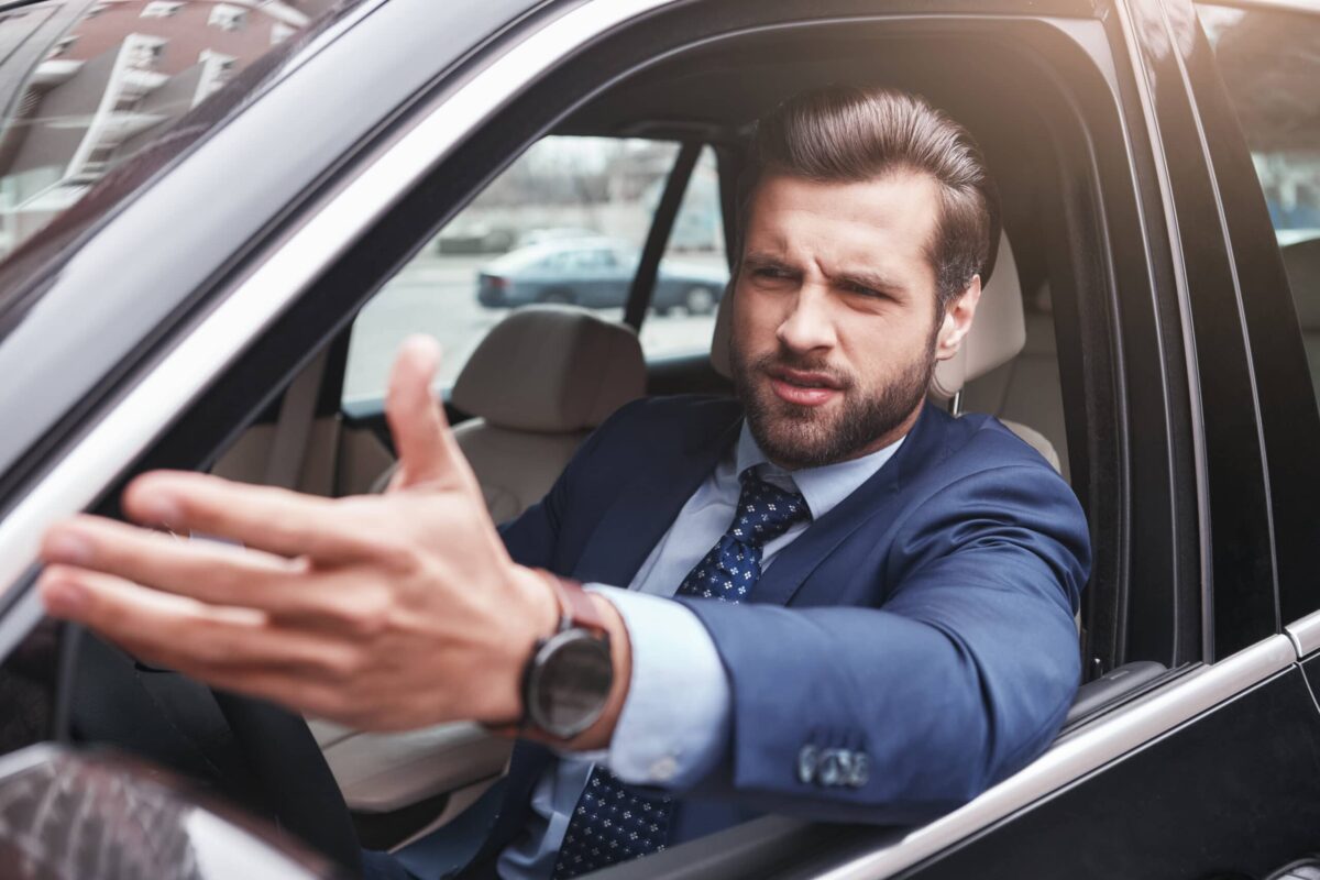 A businessman complaining about rude driving
